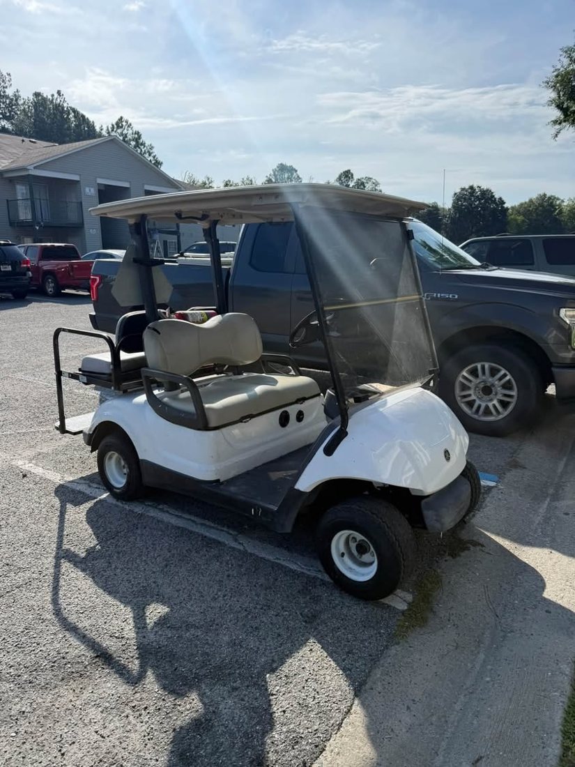 White Yamaha golf cart after a lithium battery install and new front seat
